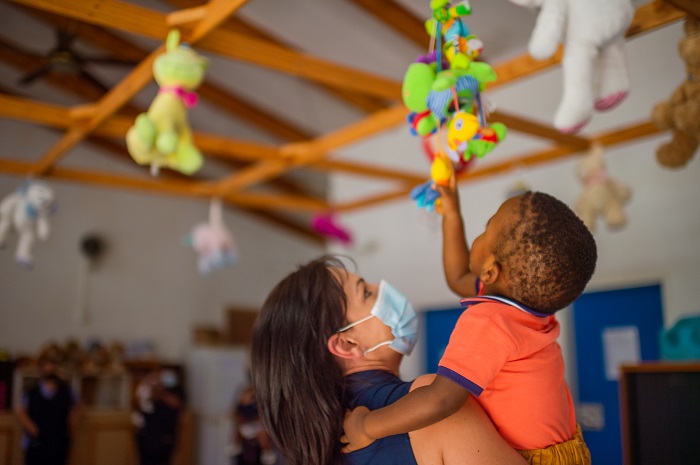 child in ladys arms