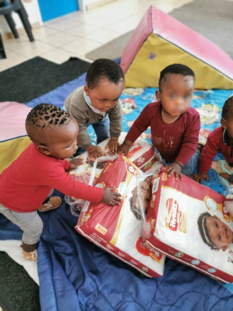 toddlers receiving nappies